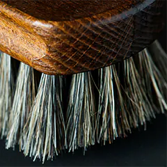 Clean a mattress: Soft-bristled brush