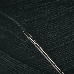 Needle and matching thread to hem pants